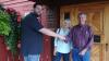 A warm welcome - New Lutsen Resort owner Bryce Campbell with former owners Nancy Burns and Scott Harrison